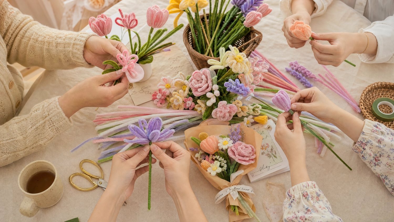 Friends making handmade flowers together at a letsbloom event